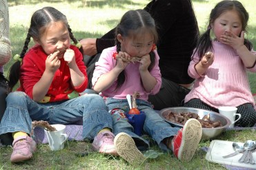 Odgoo daughters eating off the bone